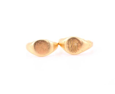 A pair of Tiffany & Co. yellow gold signet rings. The first consisting an oval head measuring approximately 9.8 x 9.2 mm, eng