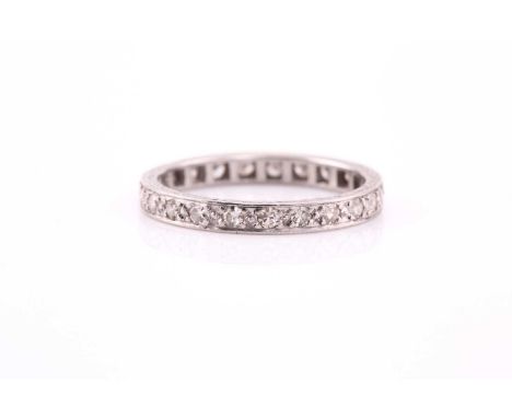 An Art Deco diamond eternity ring, consisting of 23 round brilliant diamonds estimated at 0.46cts, bead set on a white metal 
