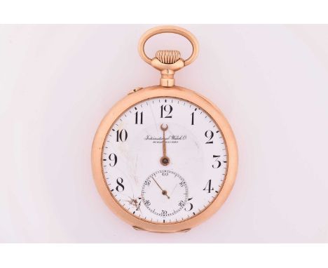 An IWC Schaffhausen International Watch co. 14kt gold open face pocket watch with a white enamel dial and seconds sub-dial at