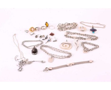 A collection of white metal jewellery comprising; nine necklaces, two bracelets, five rings, a scarf ring, a mother of pearl 