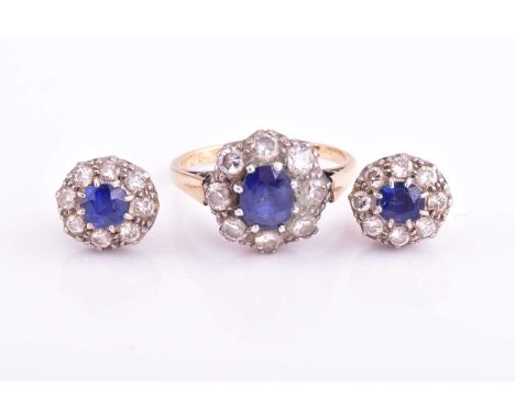 A lot consisting of a sapphire and moissanite ring and matching earrings, the ring features an oval sapphire measuring 7.3x 5