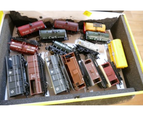 Box of 00 gauge wagons and tankers, some by Bachmann and Hornby