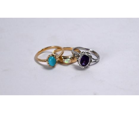 Three various 9ct rings - one set cabochon opal, size P, one oval turquoise, size O, one oval amethyst, white gold set size O