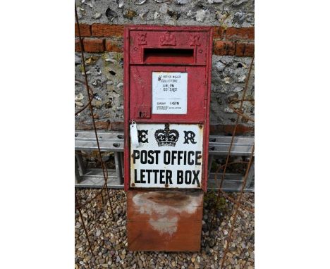 An Edwardian cast iron Post Office wall-box front, with enamel plates, 69 cm x 35 cm a/f, mounted to a wooden box&nbsp;&nbsp;