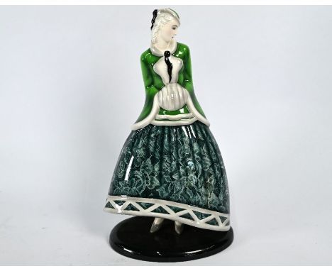 A Goldscheider pottery female figure, dressed for winter in green jacket, muff and lacy skirt, 33 cm highRestored at back of 