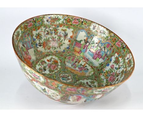 A 19th century Chinese Canton famille rose punch bowl, late Qing dynasty, painted in the typical palette of polychrome enamel