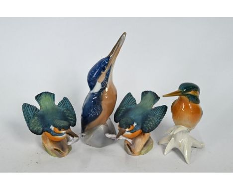 A pair of Royal Worcester painted bisque Kingfishers, 8 cm high to/w a Royal Copenhagen Kingfisher and a Karl Ens Kingfisher 