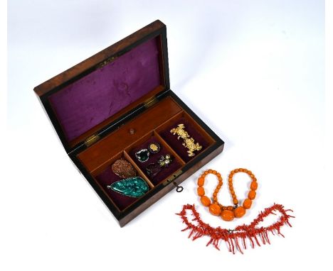 Wooden writing box including quantity of jewellery items including faceted amber necklace, 55g; antique stick coral, syntheti