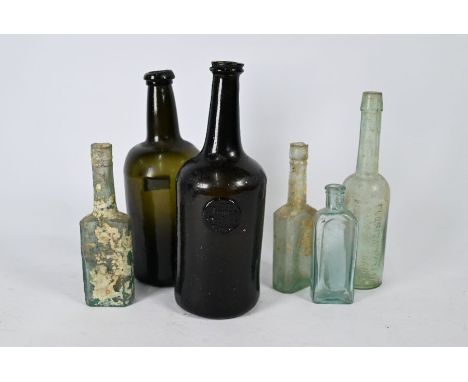 An 18th century green glass bottle of mallet form, with applied button impressed '1770 James Oakes Bury' 16 cm high, to/w ano