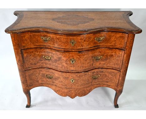 A continental walnut, maple, parqutery and marquetry serpentine commode, 18th century, with three drawers, raised on cabriole