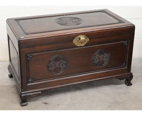 A carved Oriental hardwood camphor lined trunk, circa 1950s, 102 cm w x 53 cm x 60 cm h