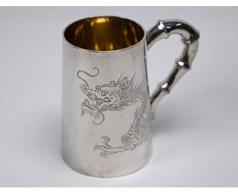 A Chinese silver mug of tapering form with dragon engraving and simulated bamboo handle, stamped 'WF' &amp; '90', 5oz, 8.3cm 