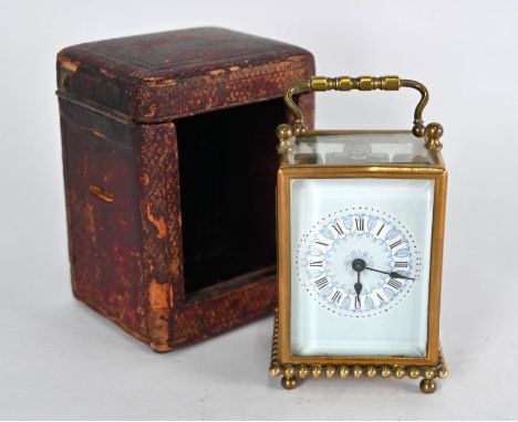 A small&nbsp; late 19th century brass carriage clock, the single train movement with pale blue enameled dial, in leather trav