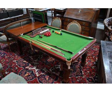 E Riley, a vintage mahogany metamorphic billiards / dining table, the baize lined playing surface enclosed by four table top 