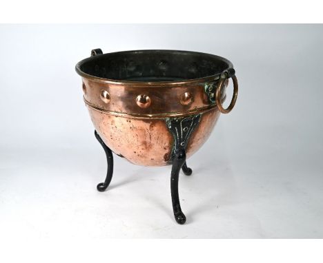 Henry Loverage, an Arts &amp; Crafts copper jardiniere on iron tripod legs, bears makers stamp, 32.5 cm dia. x 31 cm h