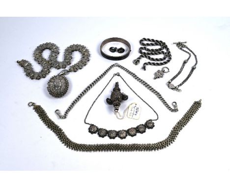 A collection of mainly Victorian silver and white metal jewellery items including Albert chain, locket on fancy link chain, G