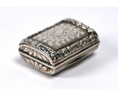 A George IV silver vinaigrette of cushion form with chased rims and engraved decoration, the gilt lining with foliate-engrave