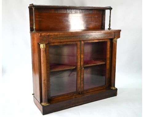 A Regency brass mounted rosewood rosewood cabinet with pair of glazed in doors, raised on a plinth base, 163 cm w x 60 cm x 9