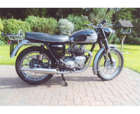 A 1960 Triumph Tiger T100A, registration number TAS 256, black and silver. 1960 saw the first unit construction engine, a maj