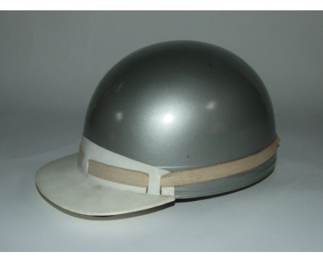 A late 1950s/early 1960s Everoak ACU racing crash helmet, with detachable peak and leather lining, and a Matchless enamel lap