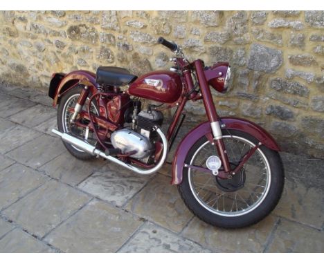 A 1952 Indian Brave, registration number NSV 906, red. Indian were renowned for their large V twin motorcycles, also produced