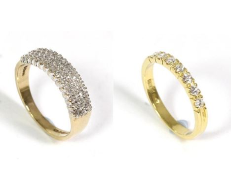 An 18 carat gold diamond half hoop ring, seven round brilliant cut diamonds in claw settings, to scooped shoulders, total est