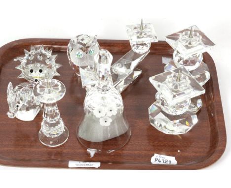 A quantity of Swarovski crystal items, to include; two twin light candelabra; a table bell, 14cm high ; an elephant; an owl; 