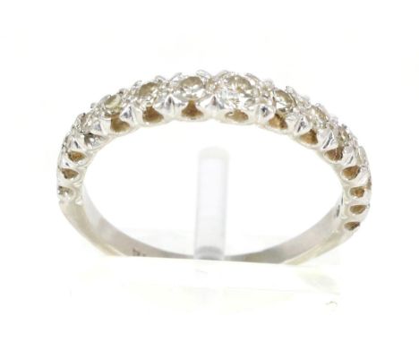 A diamond half hoop ring, graduated round brilliant cut and eight-cut diamonds in claw settings, total estimated diamond weig