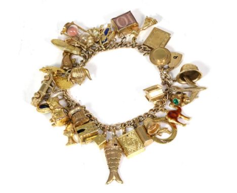 A 9 carat gold curb link charm bracelet, with 32 charms, including an articulated fish, a sand timer, four enamelled charms a
