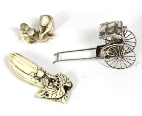 A Chinese silver cart; a 19th century Japanese ivory group, signed; and a 19th century Japanese ivory netsuke 