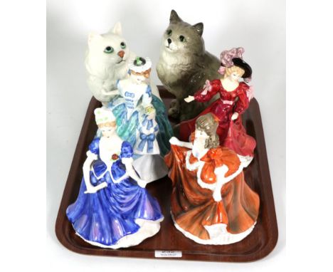 Four Royal Doulton figures and two Beswick cats 