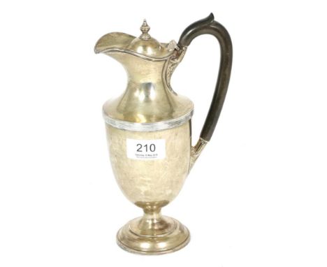 A silver hot water jug, Henry Wilkinson & Co, London 1913, vase shaped with reeded band, 23cm high14.7ozt Gross weight