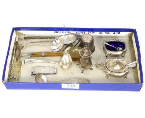 A selection of silver items including: a mdopern silver spoon by Brian Fuller, London 1977; a three piece condiment set, two 