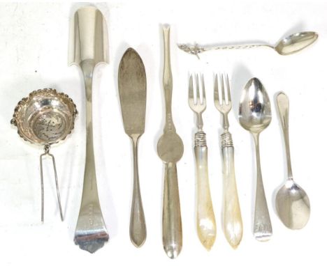 A selection of silver items comprising a stilton scoop, butter knife, lobster fork with fluted handle, Victorian tea infuser 