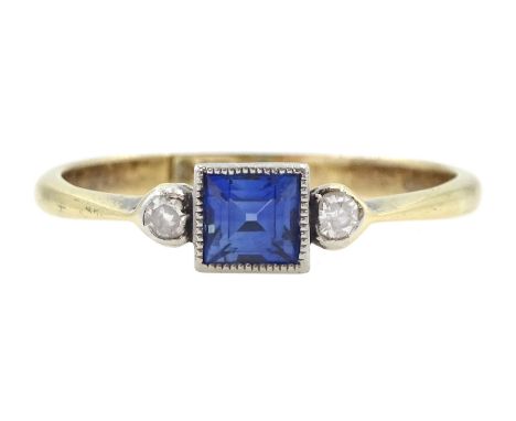 Early 20th century gold milgrain set three stone square cut blue stone and single cut diamond ring, stamped 18ctCondition Rep