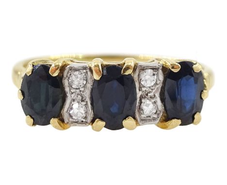 18ct gold three stone oval cut sapphire and four stone round brilliant cut diamond ring, Sheffield 1990Condition Report:Appro