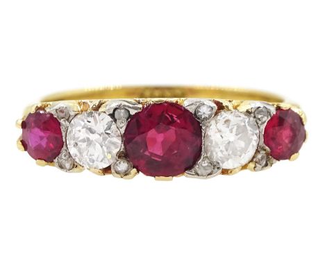 Early 20th century five stone old cut diamond and ruby ring, with diamond accents set between, stamped 18ct, total diamond we