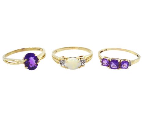 Three 9ct gold rings including amethyst and diamond, opal and diamond and a single stone amethyst, all hallmarked 9ctConditio