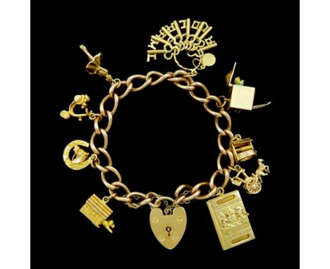 9ct old curb link chain bracelet, with heart locket clasp and eight 9ct gold charms including Jack in a box by Georg Jensen, 