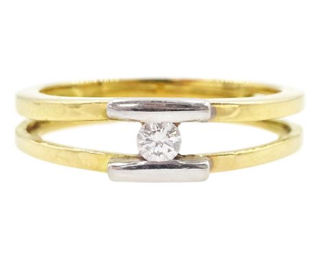18ct gold white and yellow gold tension set, round brilliant cut diamond ring, stamped 750Condition Report:Approx 3.35gm, tes
