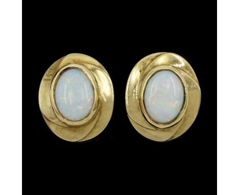 Pair of 9ct gold single stone opal stud earrings, hallmarkedCondition Report:Approx 3.7gm, overall head = 13.5mm x 11.5mm, po
