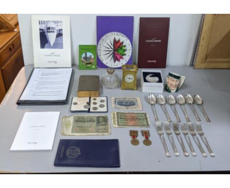 Collectables to include Concord related items, coins, a carriage clock, a silver topped scent bottle A/F, medals and other it