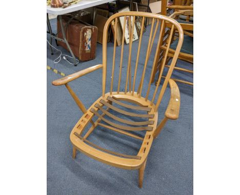 A mid 20th century Ercol beech spindle back lounge armchairLocation: 