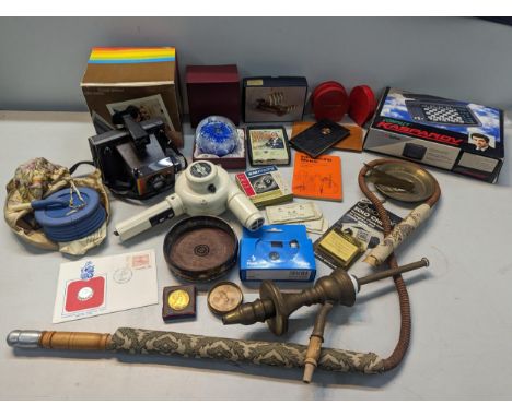A mixed lot to include a boxed Polaroid camera, electronic chess set, vintage games, model Carthaginian Quinquereme, paperwei