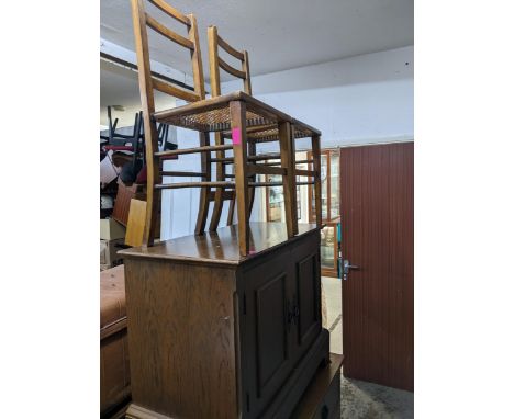 Edwardian oak chest of two short and two long drawers with brass ring handles, on bracket feet, gilt metal patent label to on