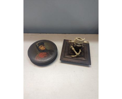 A 19th century ebonised papier mache snuff box, with a portrait of The Prince of Orange, together with an early 19th century 