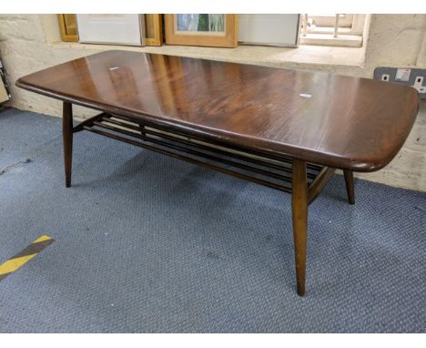 A mid 20th century Ercol stained elm and beech coffee table with magazine rack below, 36cm h x 105cm wLocation: 