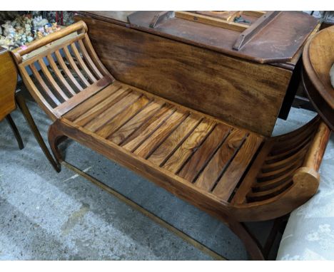 A 20th century carved wooden stool, upholstered top, French carved cabriole legs on scrolled feet, and a modern slatted woode
