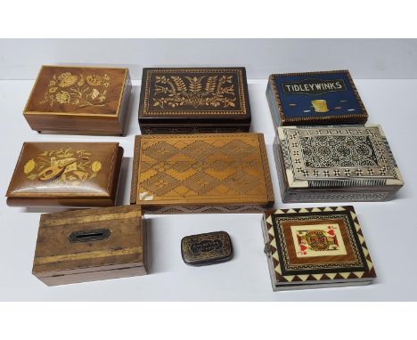 Seven good quality inlaid or carved boxes together with an old Tiddly Winks box and contents and a decorated and inscribed sn