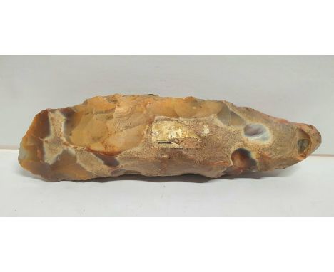 Stone Age axe head with sharpened edge to one end and rounded end to the other, 17 cm long